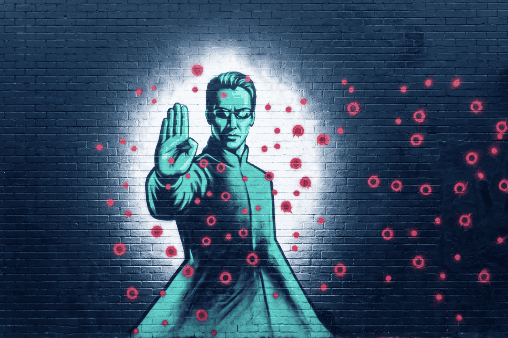 Murale di Neo in Matrix che ferma i proiettili incominciando a Credere: è arte urbana moderna.